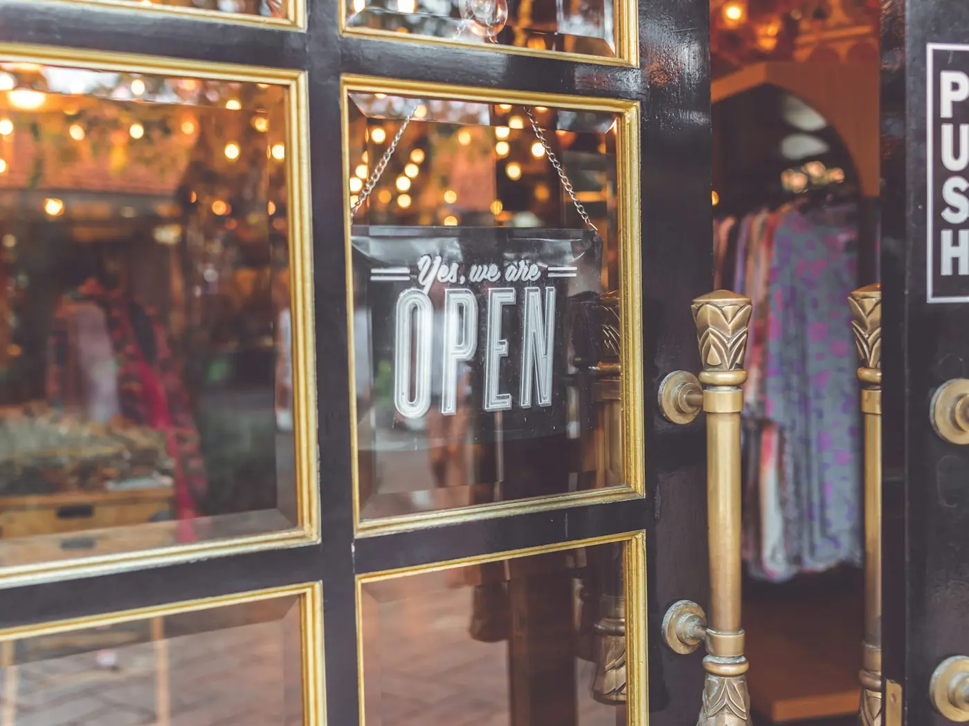 An open sign on a shop door